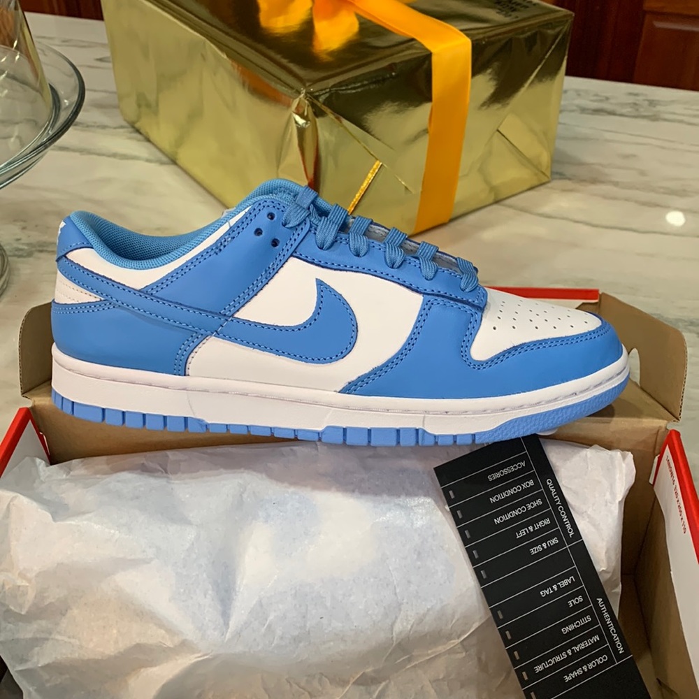 Brand new, unworn White/University Blue-White Nike Dunk Low Retro. Size 8.5